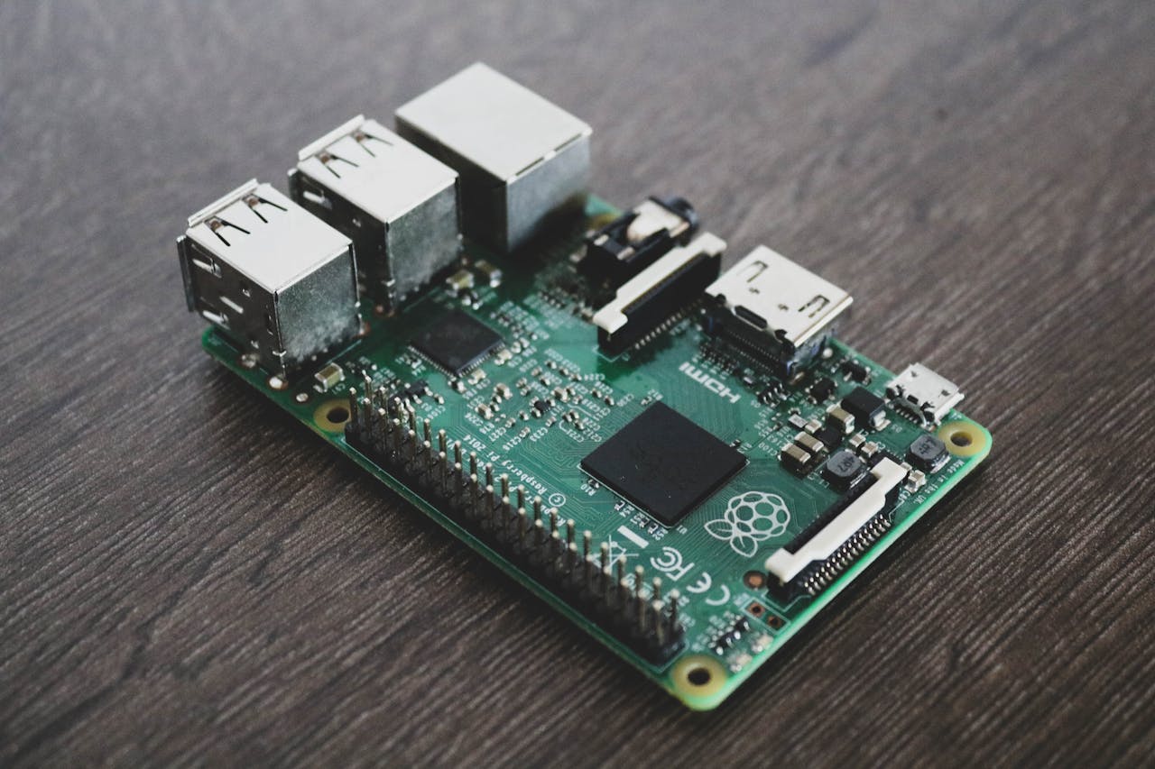 The Art of Drawing Readers In: Your attractive post title goes here Detailed view of a Raspberry Pi circuit board with microchips and components.